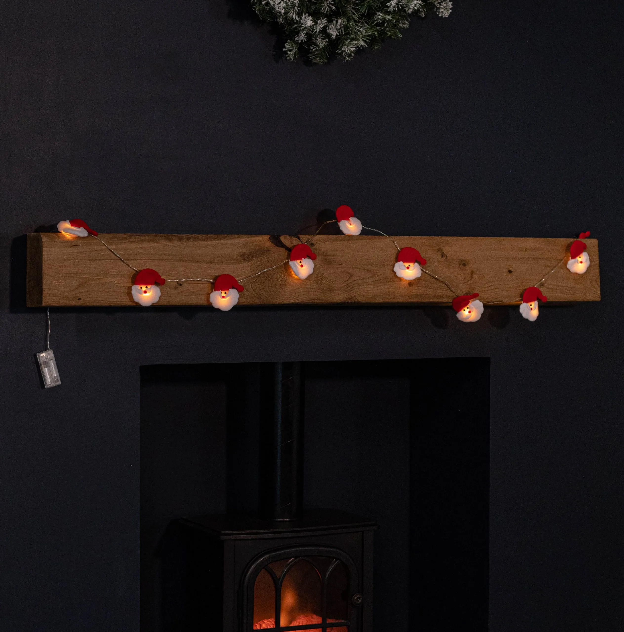 1.7m Set of 10 Battery Operated Santa's Head Christmas Lights with 10 Warm White LEDs