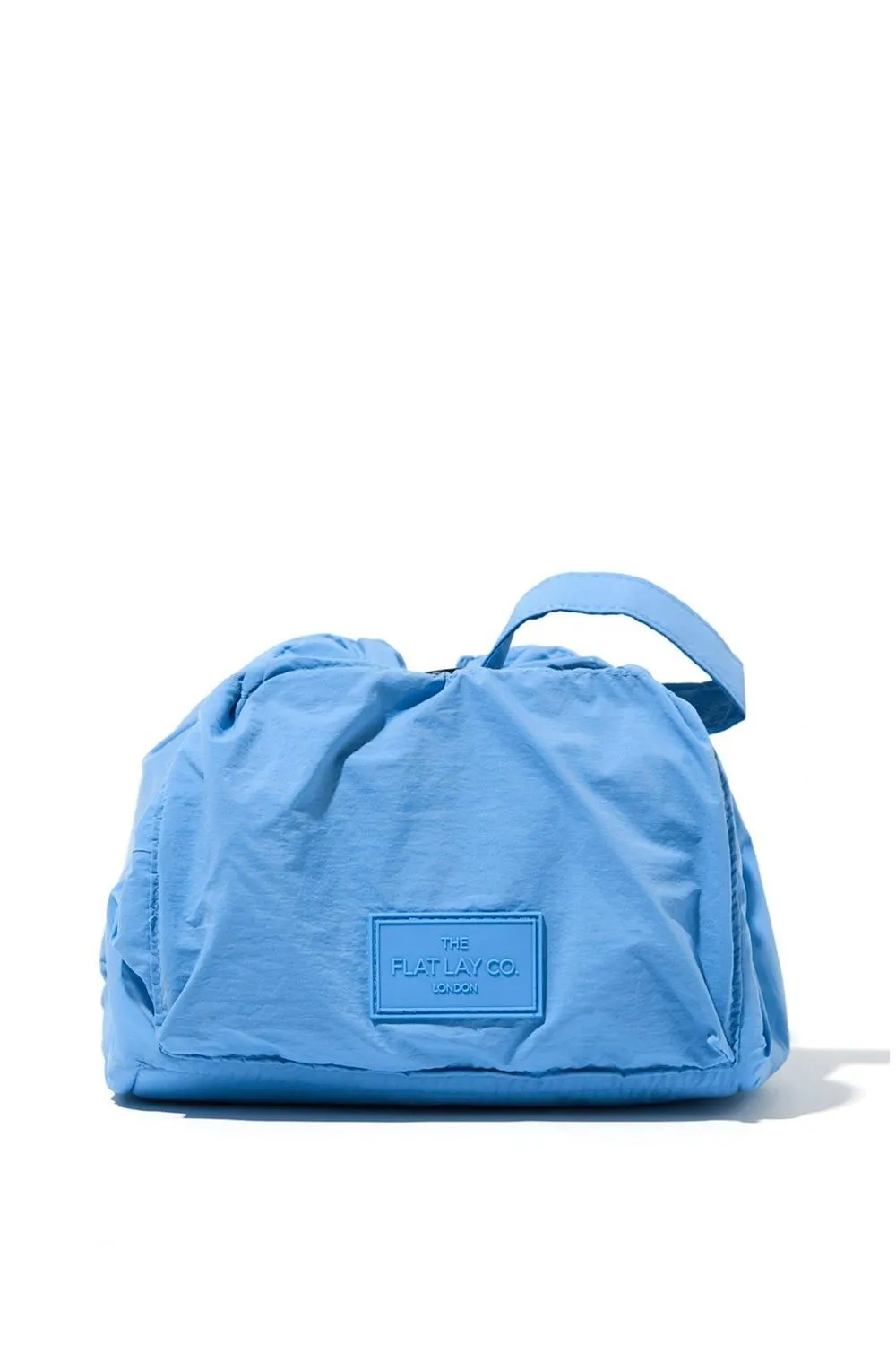 The Flat Lay Co. Drawstring Makeup Bag in Blue Parachute